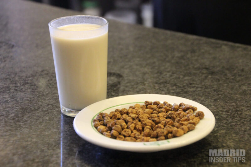 Horchata in a glass served MADRID SPAIN. There is also a place of chufa, also known as tiger nuts, the main ingredient of the Spanish Horchata.